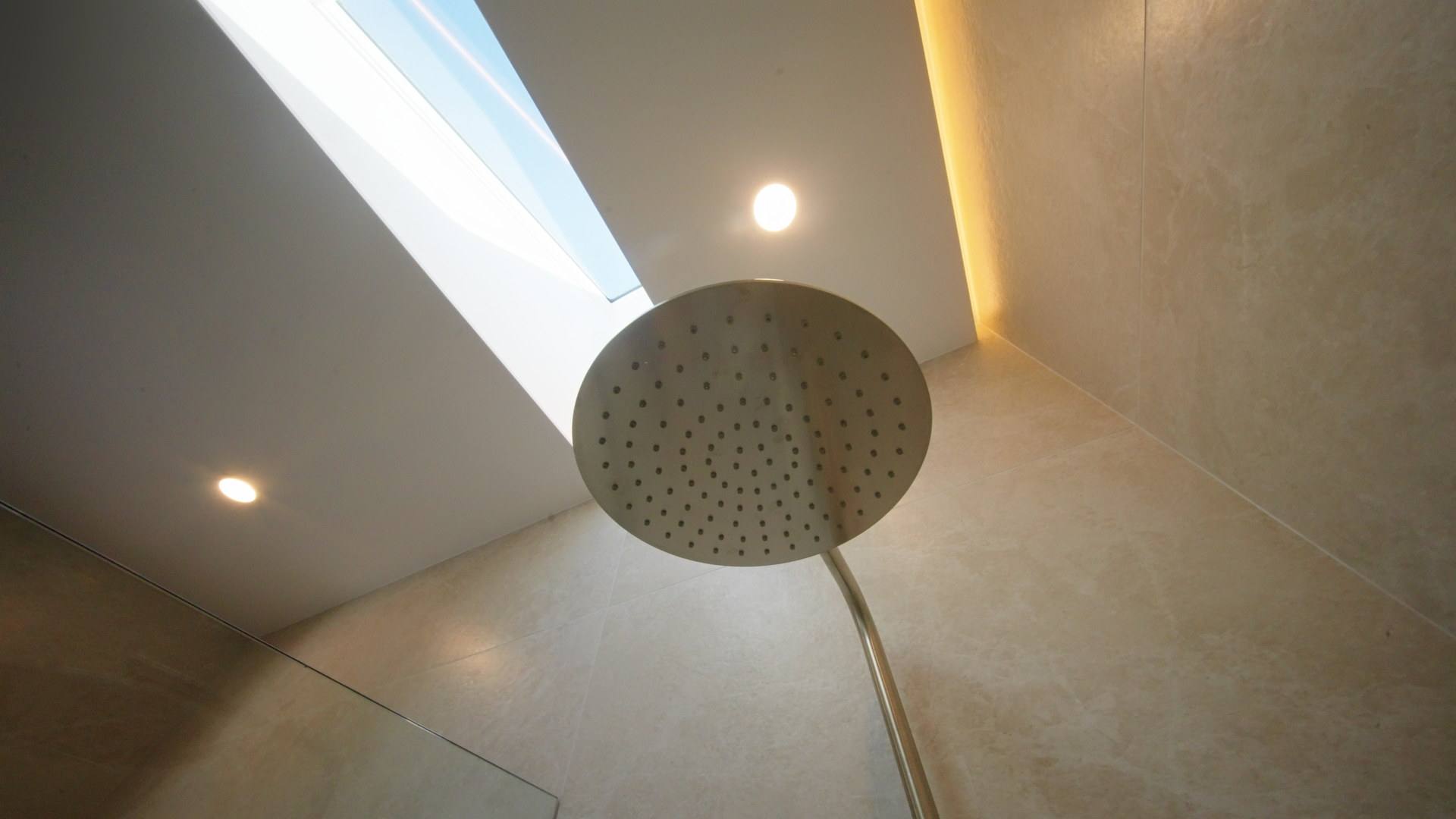 Rain shower beneath a skylight